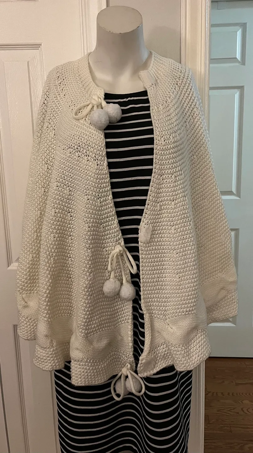 Cream Knit Cape with Pom Poms image indicator(8)