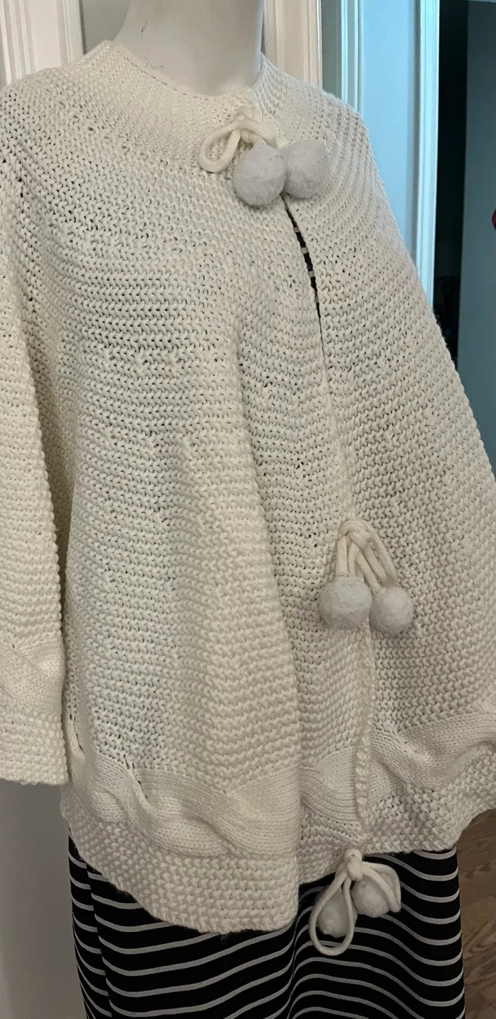 Cream Knit Cape with Pom Poms image indicator(5)