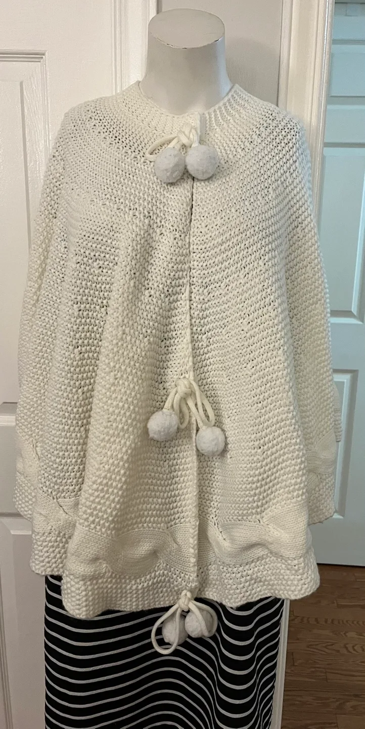 Cream Knit Cape with Pom Poms image indicator(6)