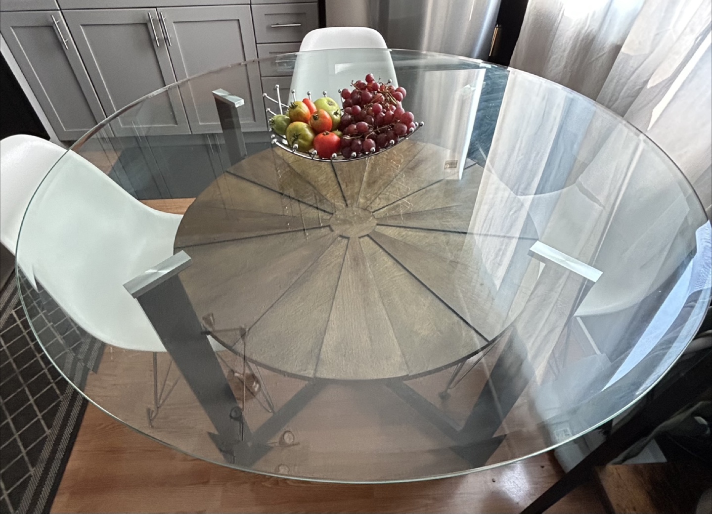 Round Glass Top Dining Table with 4 White Eiffel Dining Chairs