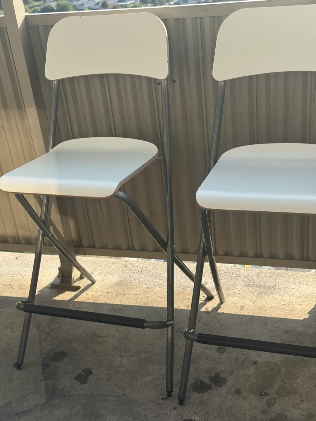 Two White IKEA Franklin Folding Counter-Height Bar Stools image indicator(2)