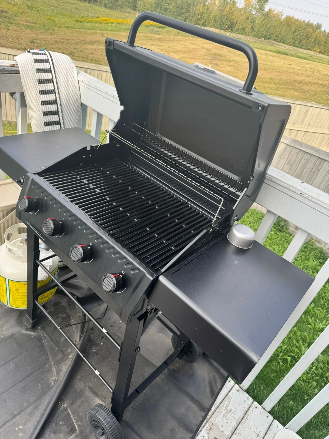 Black Propane BBQ Grill with propane cylinder
