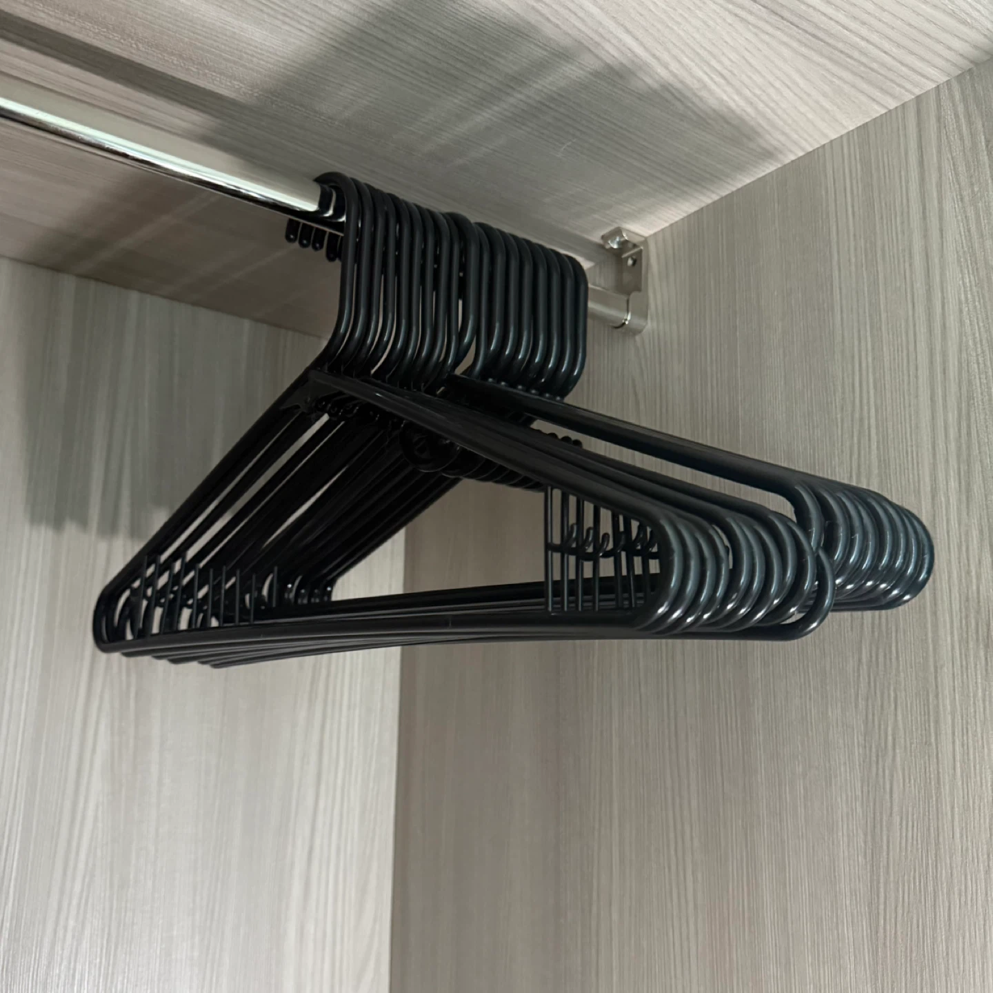 25 Black plastic clothes hangers