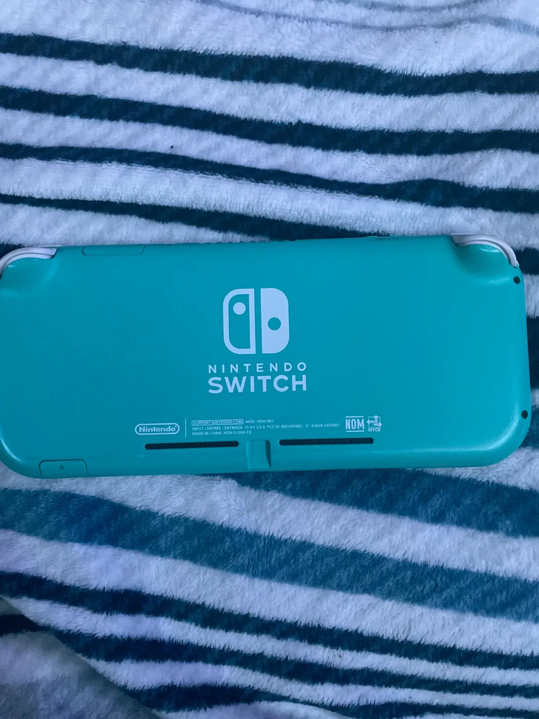 Nintendo Switch Lite with games and case image indicator(3)