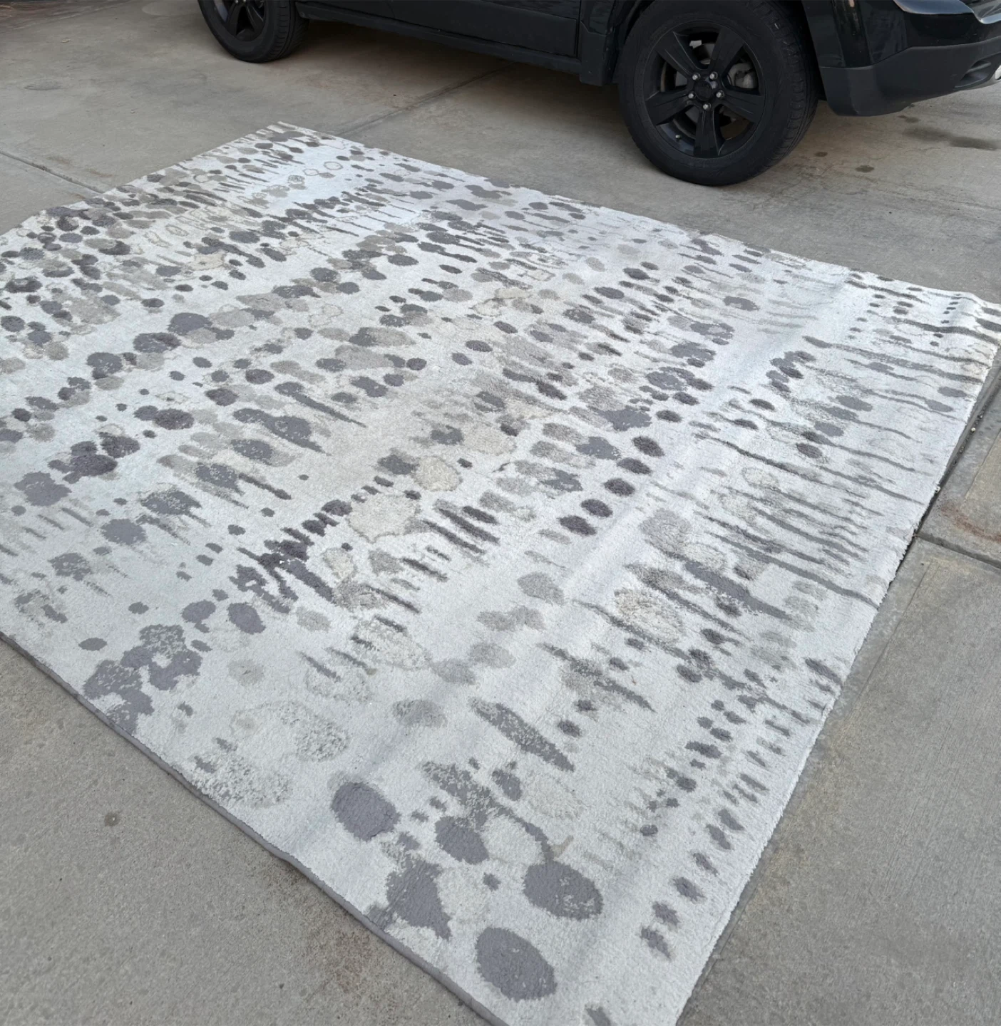 7.6 ft x 9.6 ft grey and beige area rug
