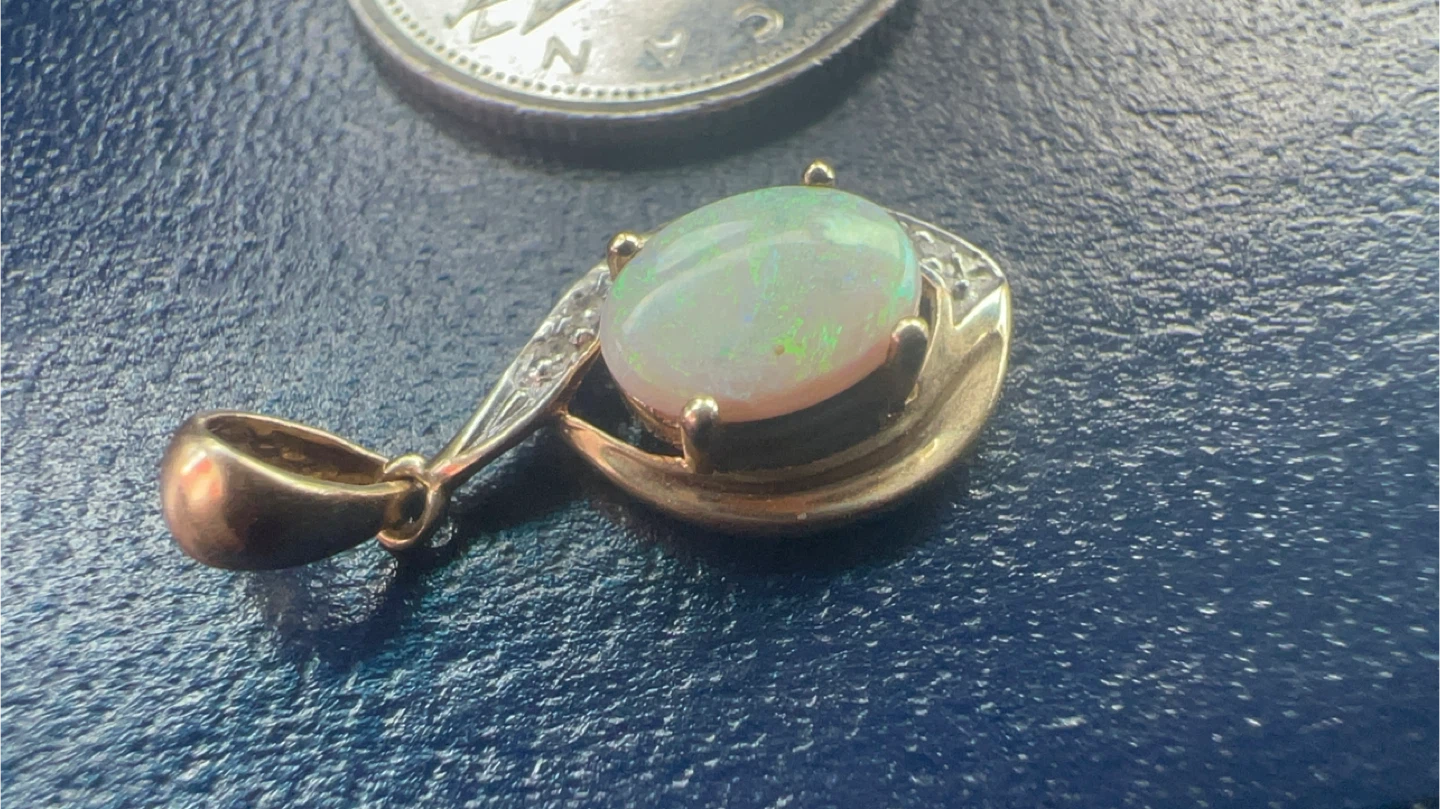 14 k Opal Pendant with diamonds