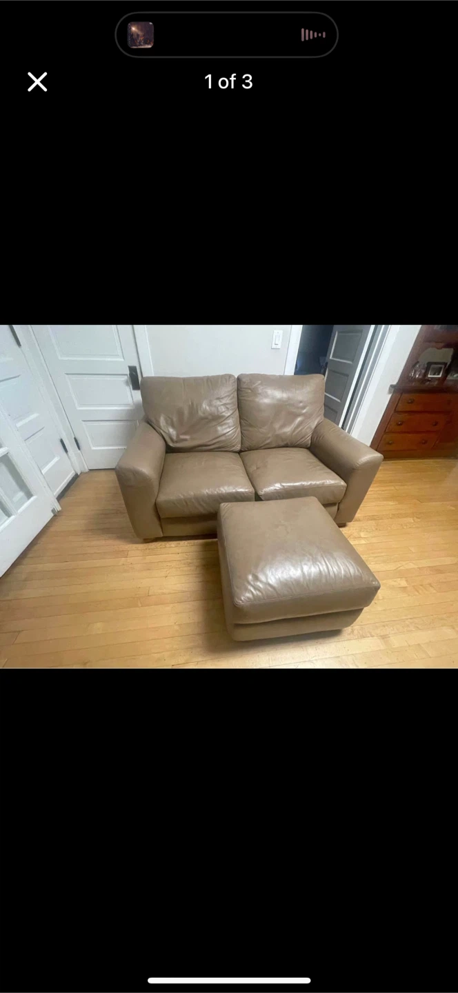Leather couch with some cat scratches.