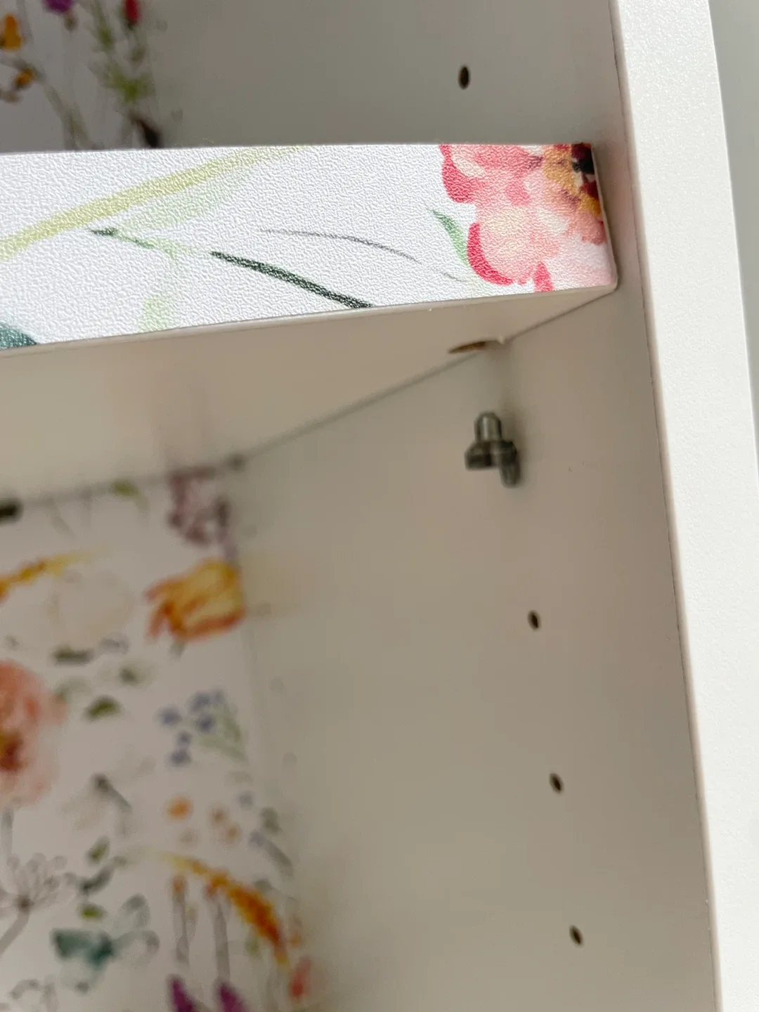 White bookcase with floral accent image indicator(6)