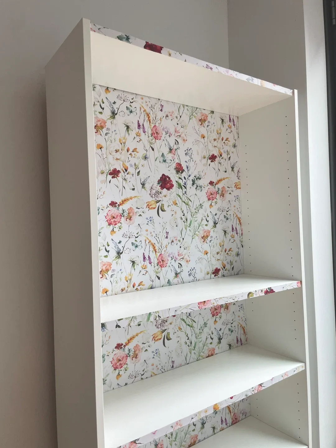 White bookcase with floral accent image indicator(3)