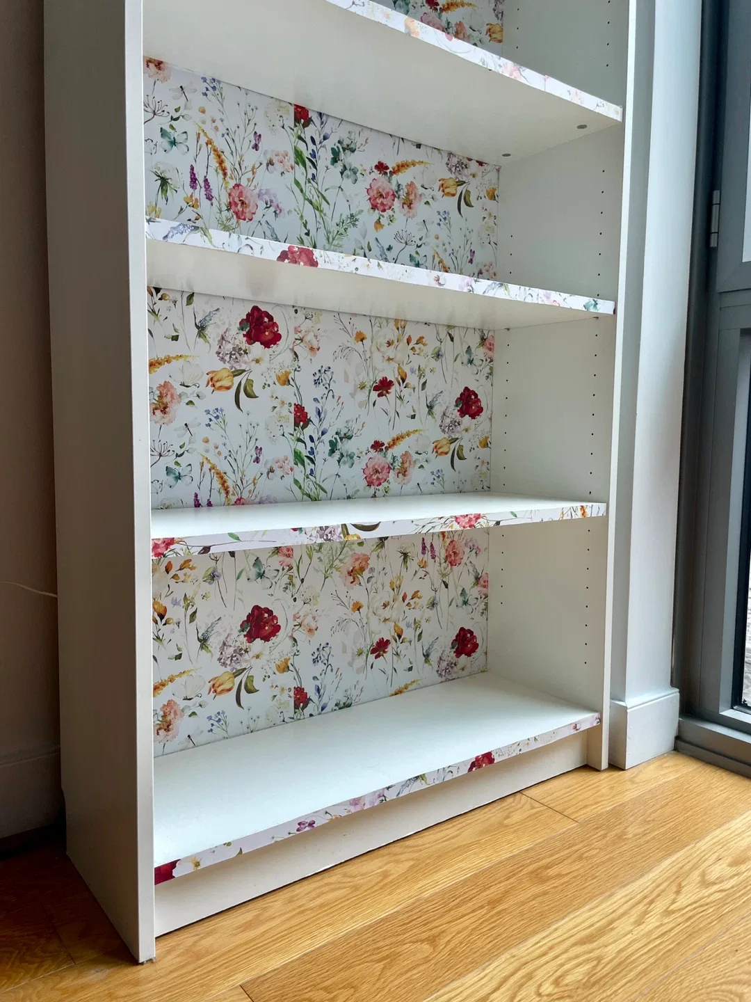White bookcase with floral accent image indicator(4)