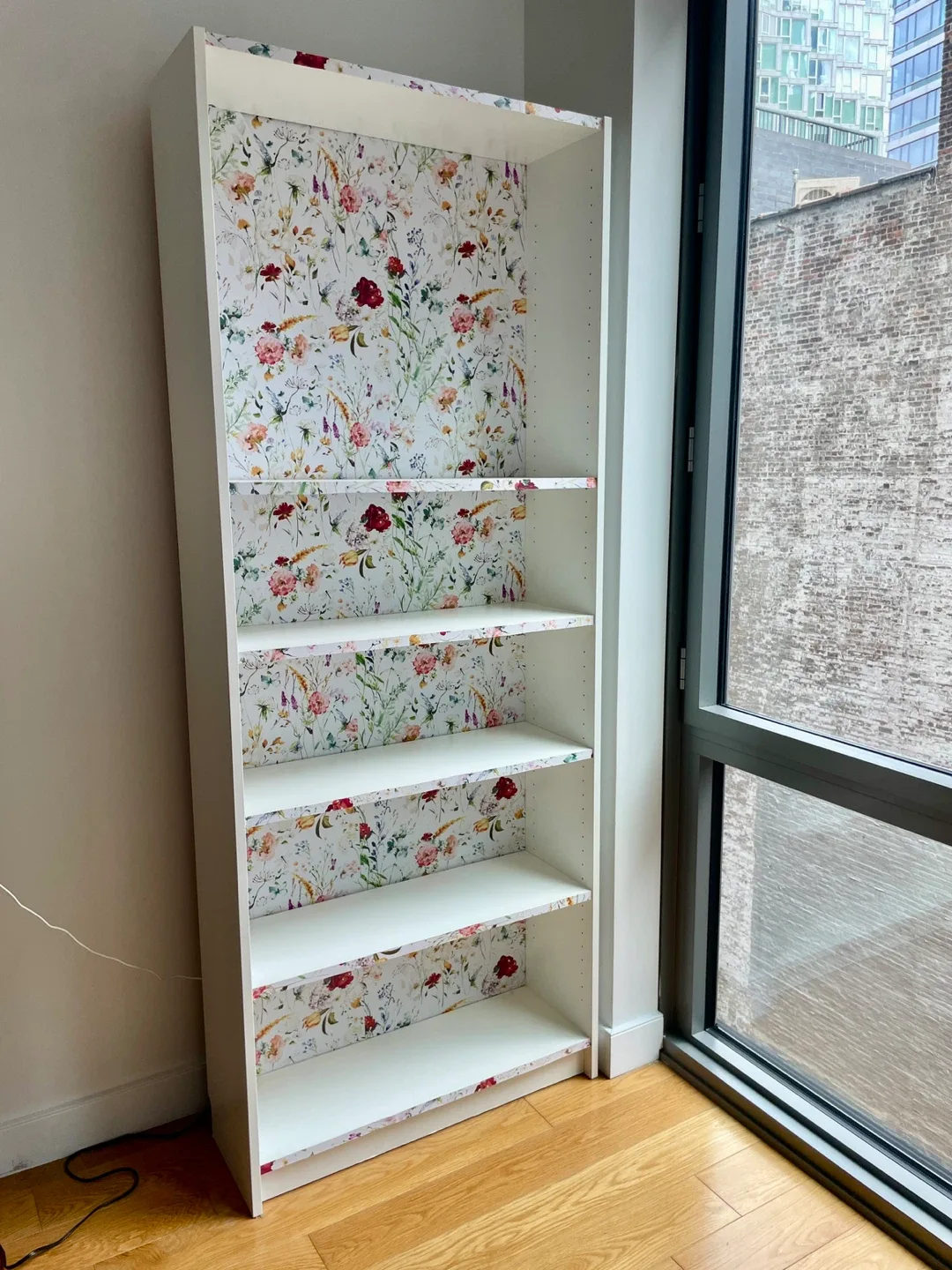 White bookcase with floral accent image indicator(2)