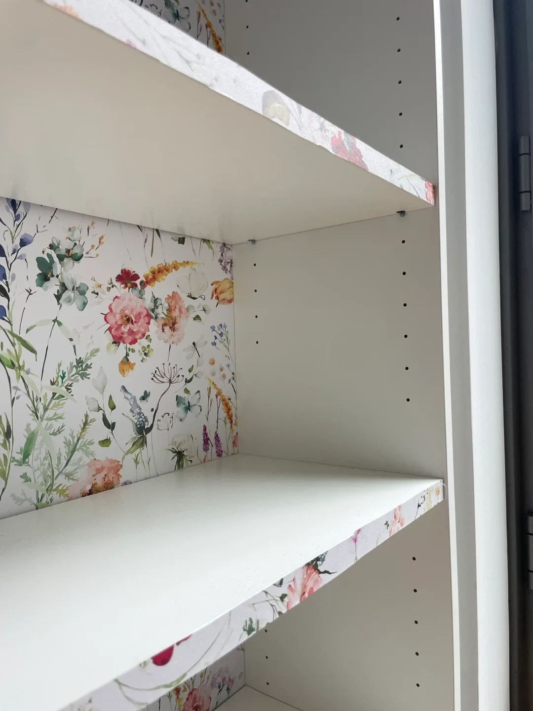 White bookcase with floral accent image indicator(5)