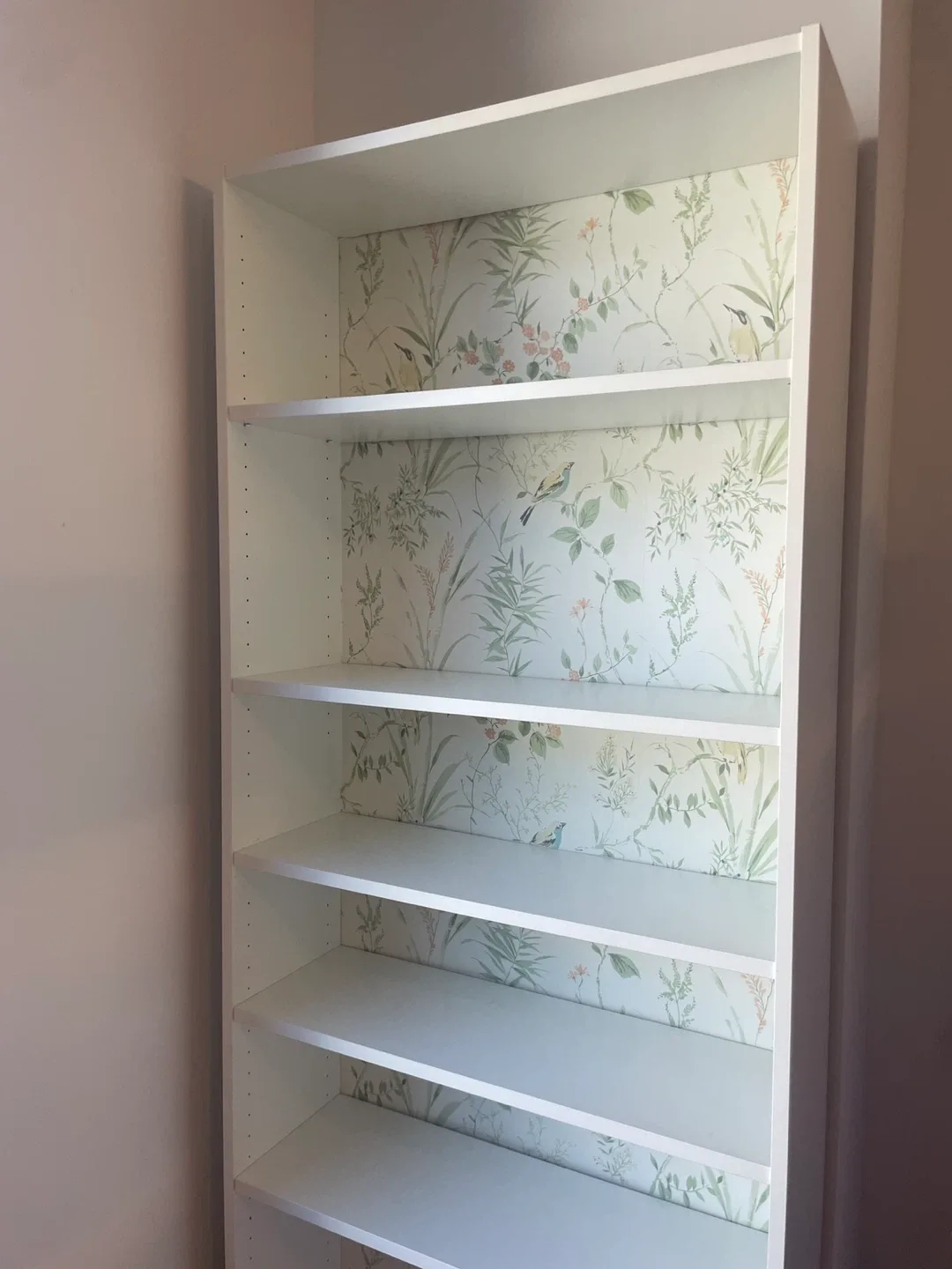 White bookcase with garden print accent image indicator(2)
