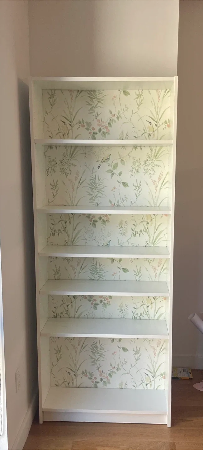 White bookcase with garden print accent image indicator(6)