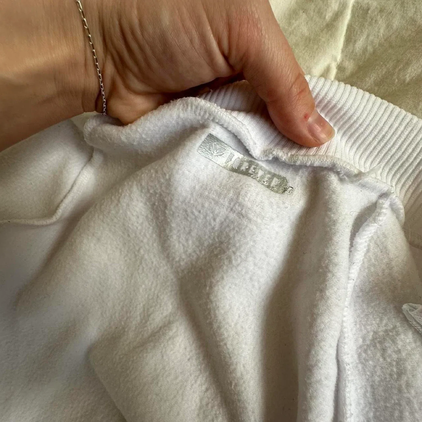 White zip-up long sleeve sweatshirt image indicator(8)