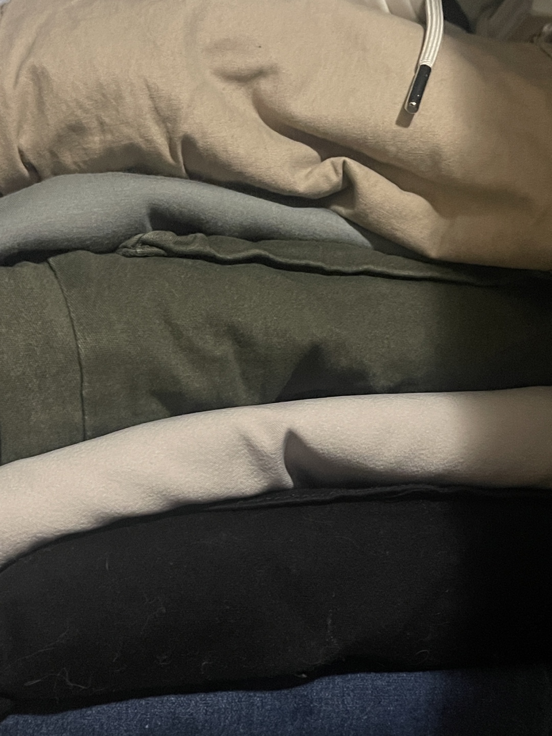 A bunch of different styles of pants