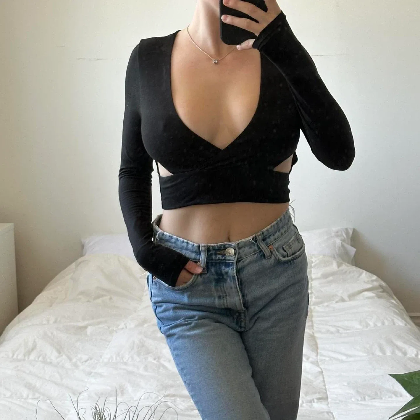 Black long sleeve crop top with cut out detail image indicator(2)