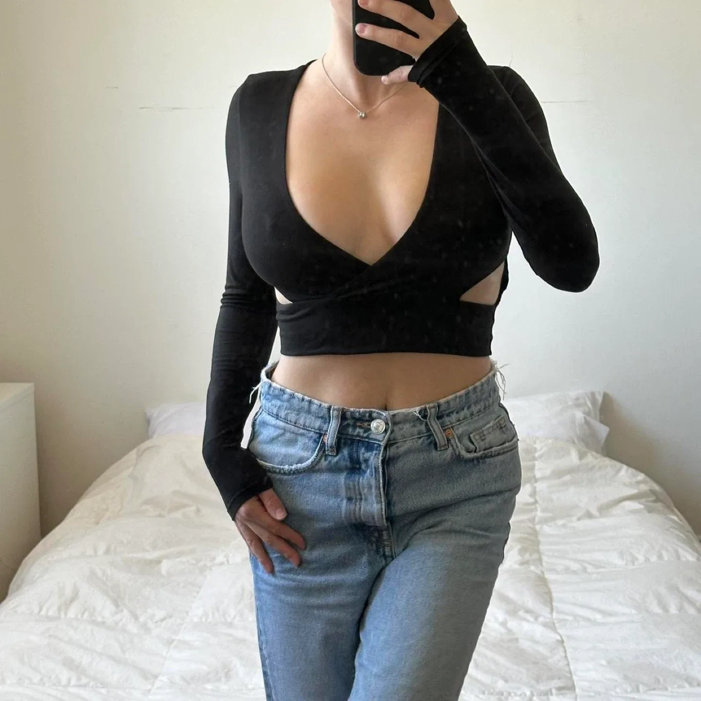 Black long sleeve crop top with cut out detail