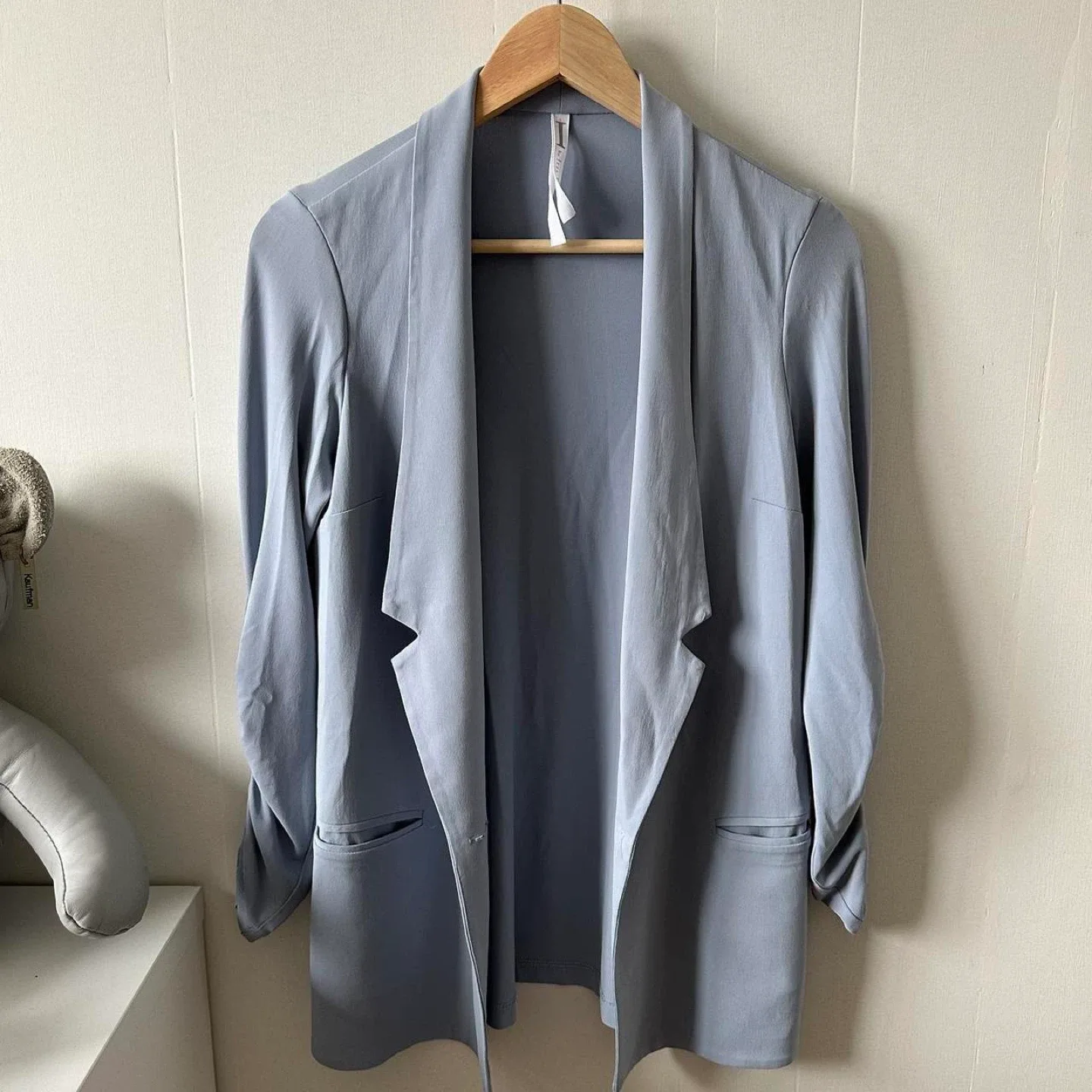 Light blue button up blazer with ruched sleeves