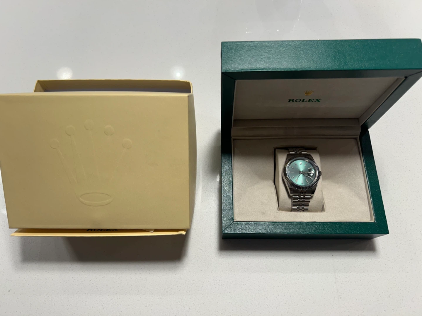 Silver watch green bezel
