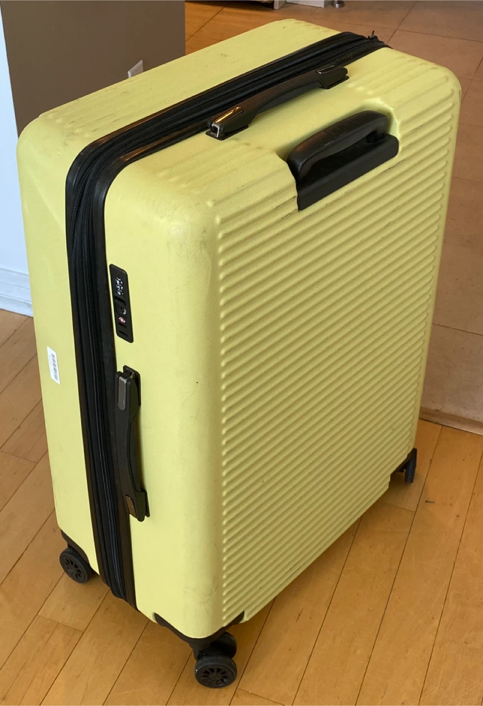 Yellow hard shell suitcase