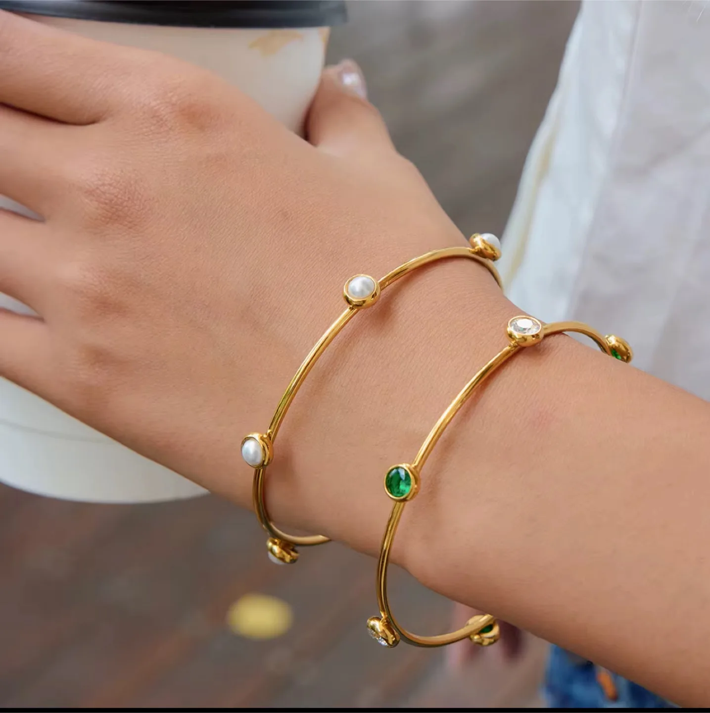 Gold Bangle Bracelets with Pearl and Gem Details image indicator(2)