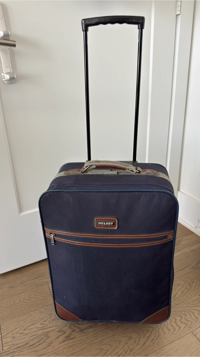 Delsey Blue Rolling Suitcase