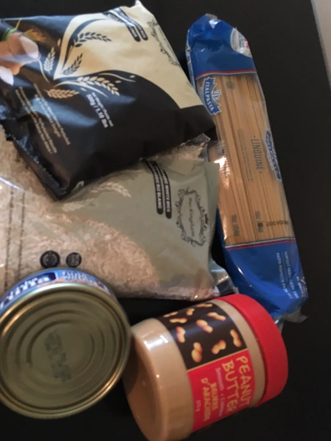 Assorted Food Items: Rice, Pasta, Tuna, Peanut Butter thumbnail