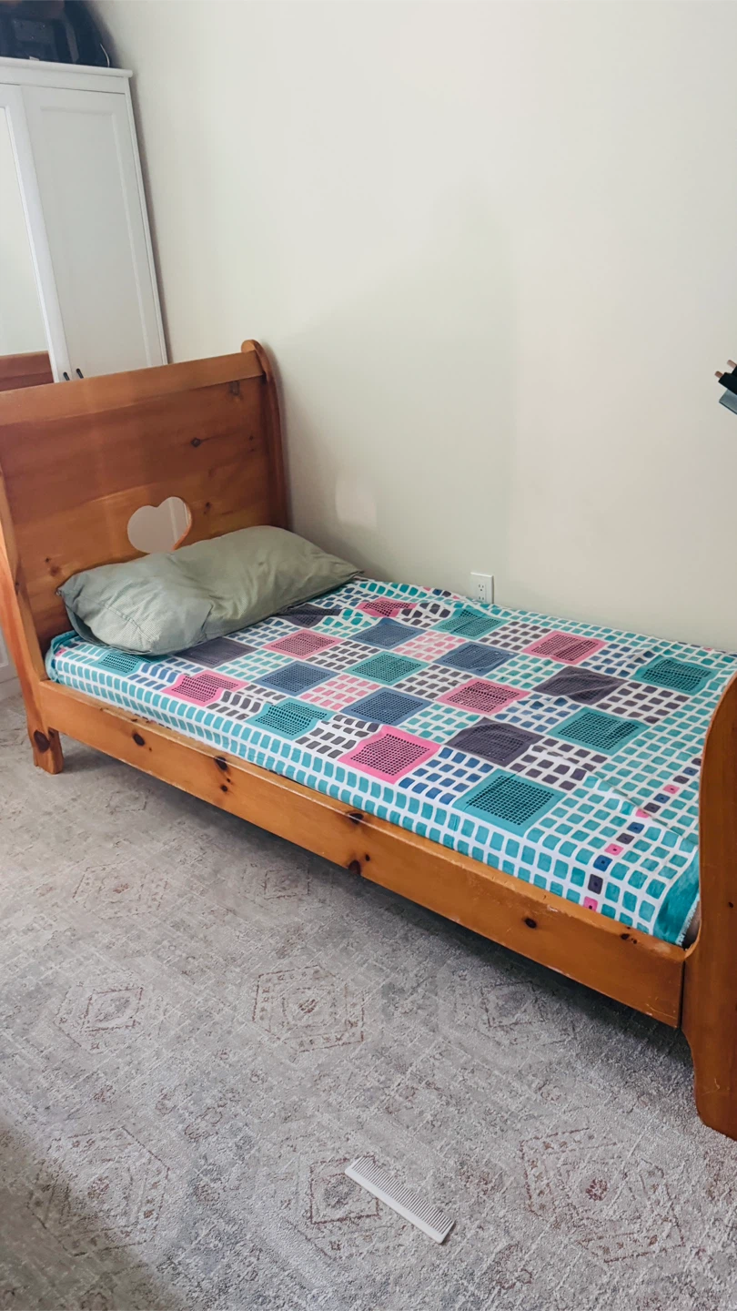 Wooden Sleigh Toddler Bed with a mattress