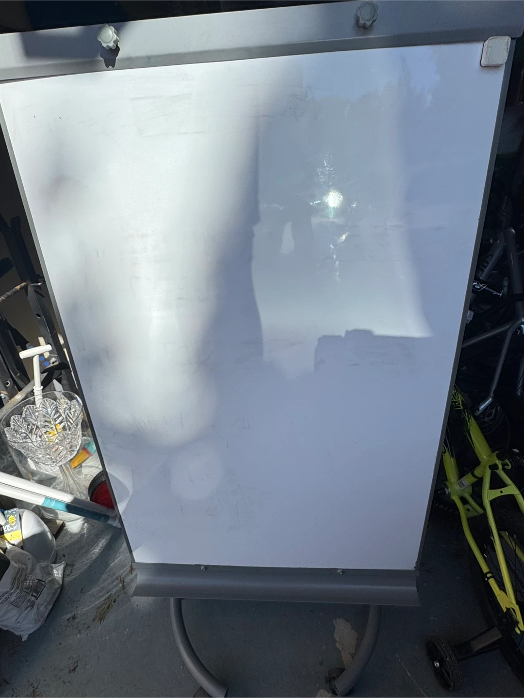 Whiteboard on wheeled stand