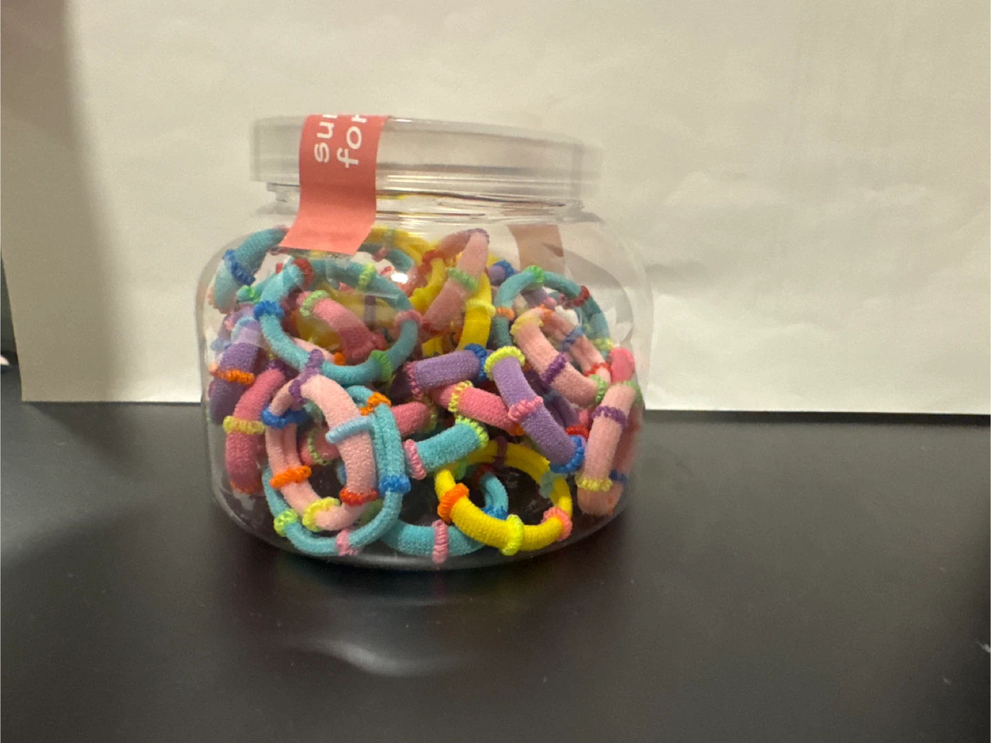 Jar of colourful hair ties