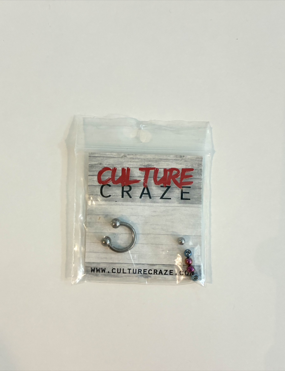 Body jewelry with replacement balls