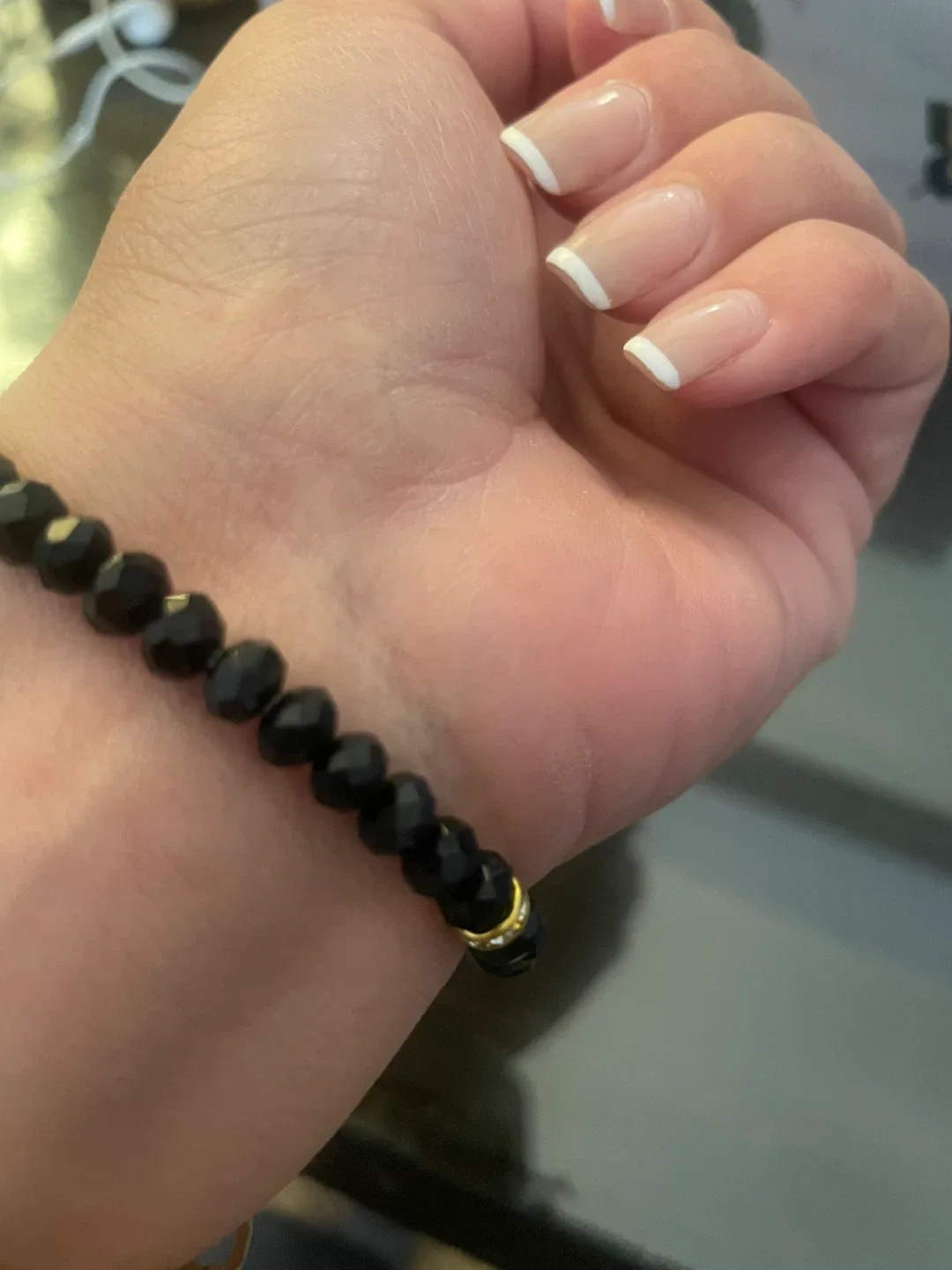 Black Beaded Bracelet with Gold Tassels image indicator(4)