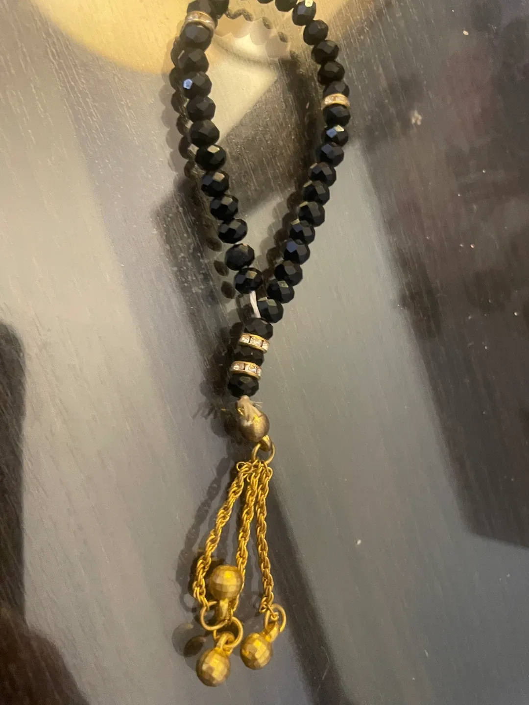 Black Beaded Bracelet with Gold Tassels image indicator(2)