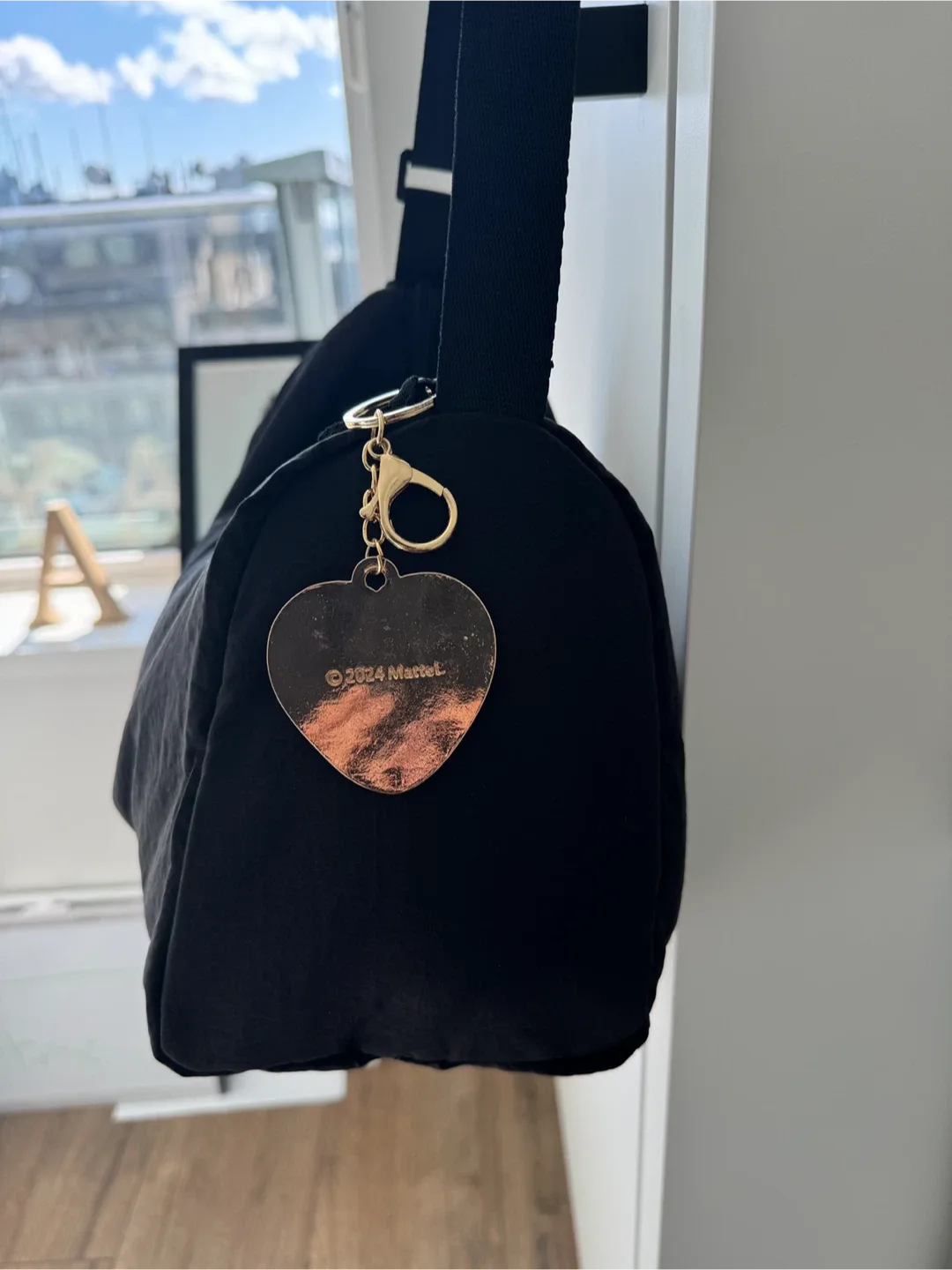 Black Shoulder Bag with a nice Barbie keychain image indicator(3)