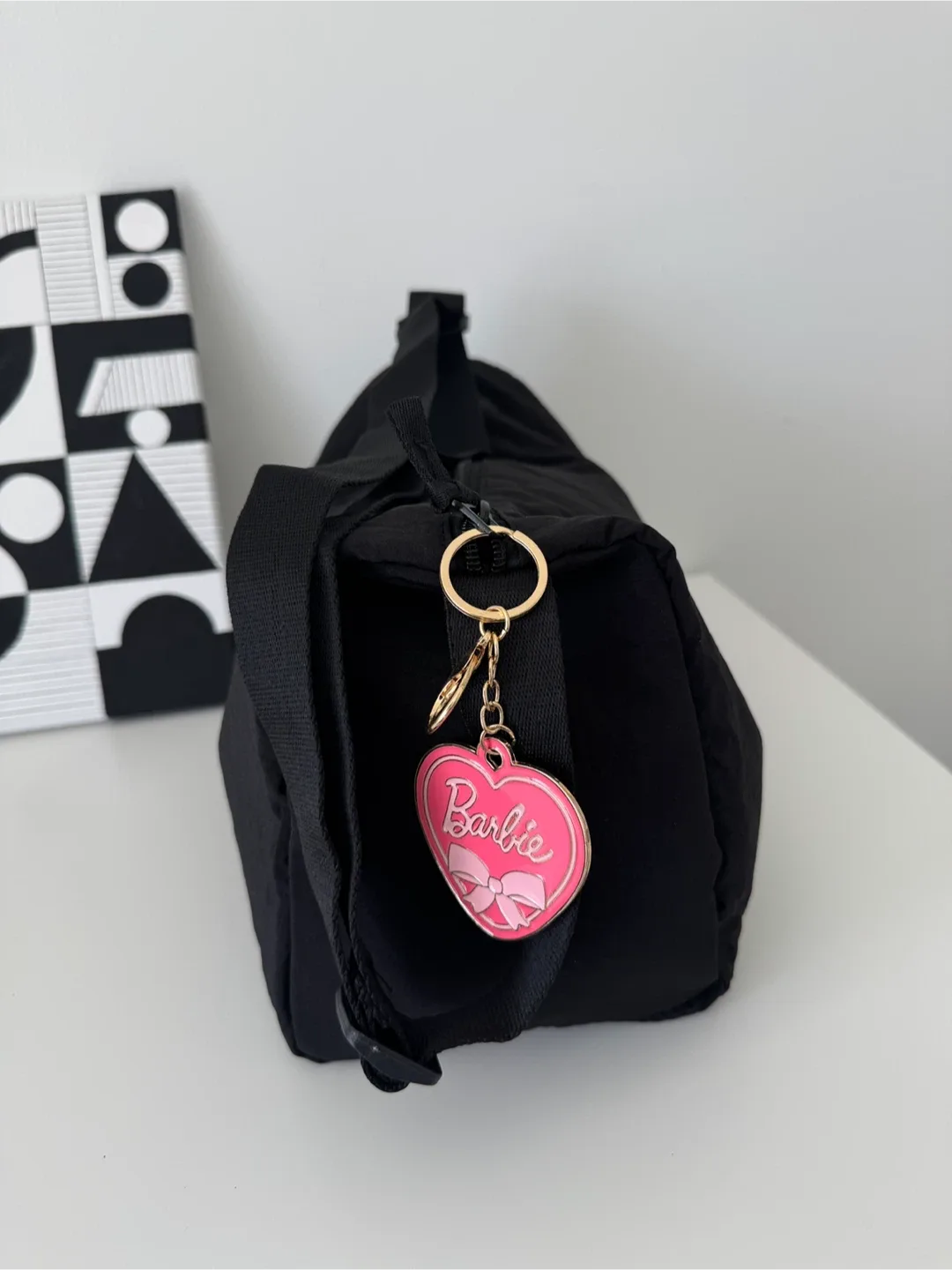 Black Shoulder Bag with a nice Barbie keychain image indicator(6)