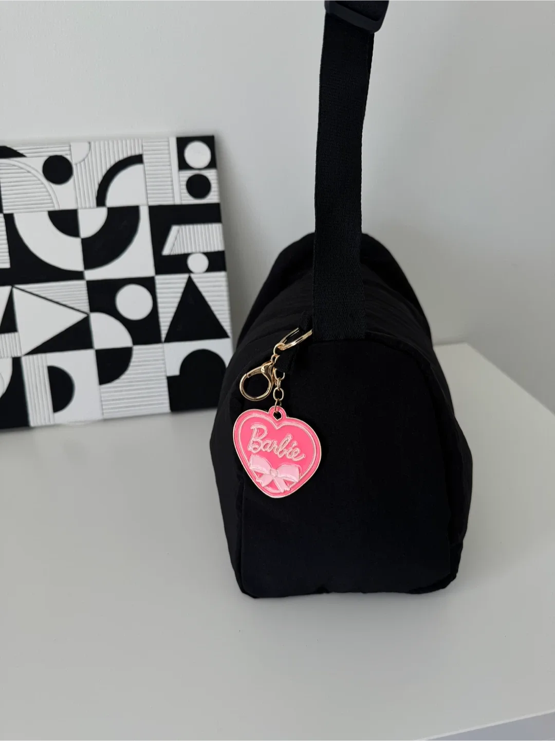 Black Shoulder Bag with a nice Barbie keychain image indicator(4)