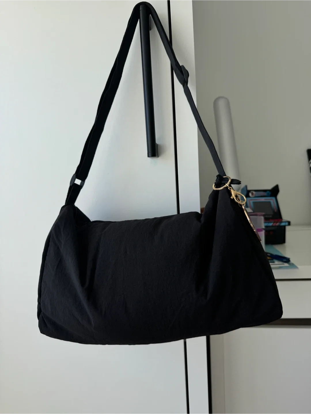 Black Shoulder Bag with a nice Barbie keychain image indicator(2)