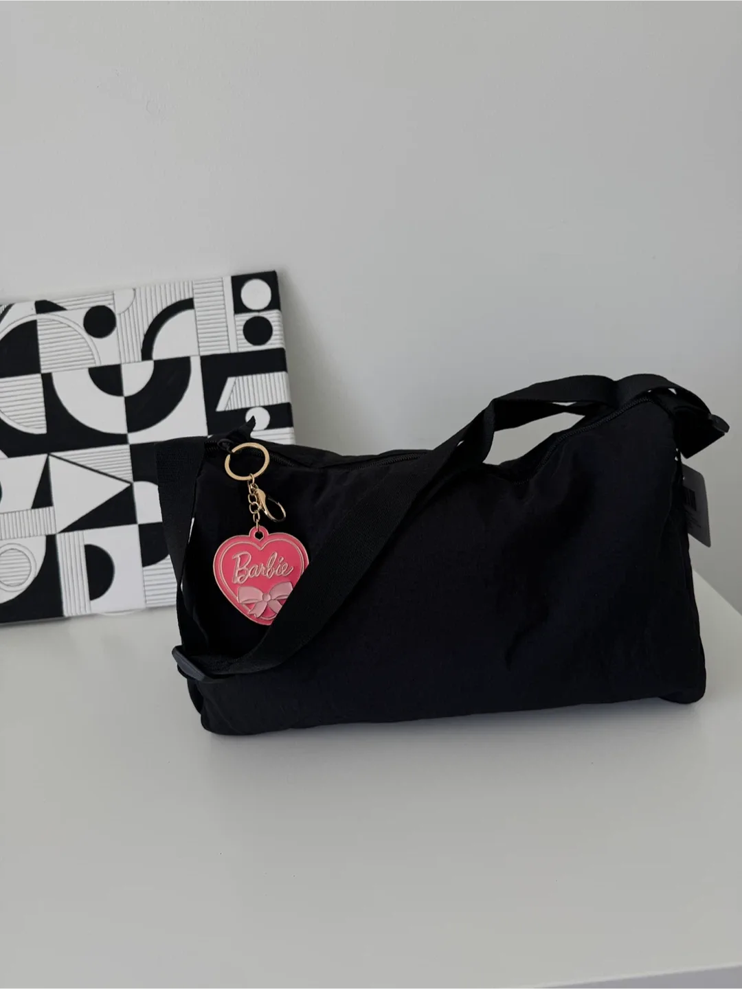 Black Shoulder Bag with a nice Barbie keychain image indicator(7)