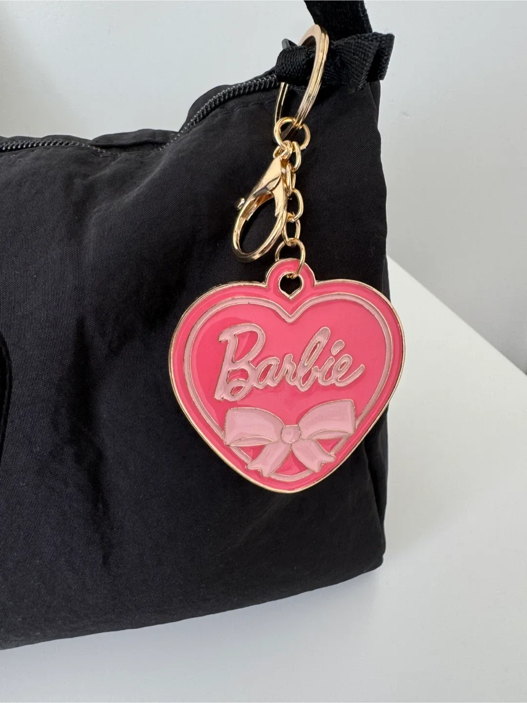 Black Shoulder Bag with a nice Barbie keychain image indicator(10)