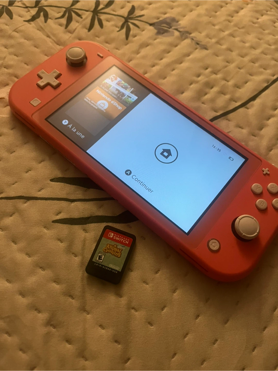 Nintendo Switch Lite Coral + Animal Crossing Game