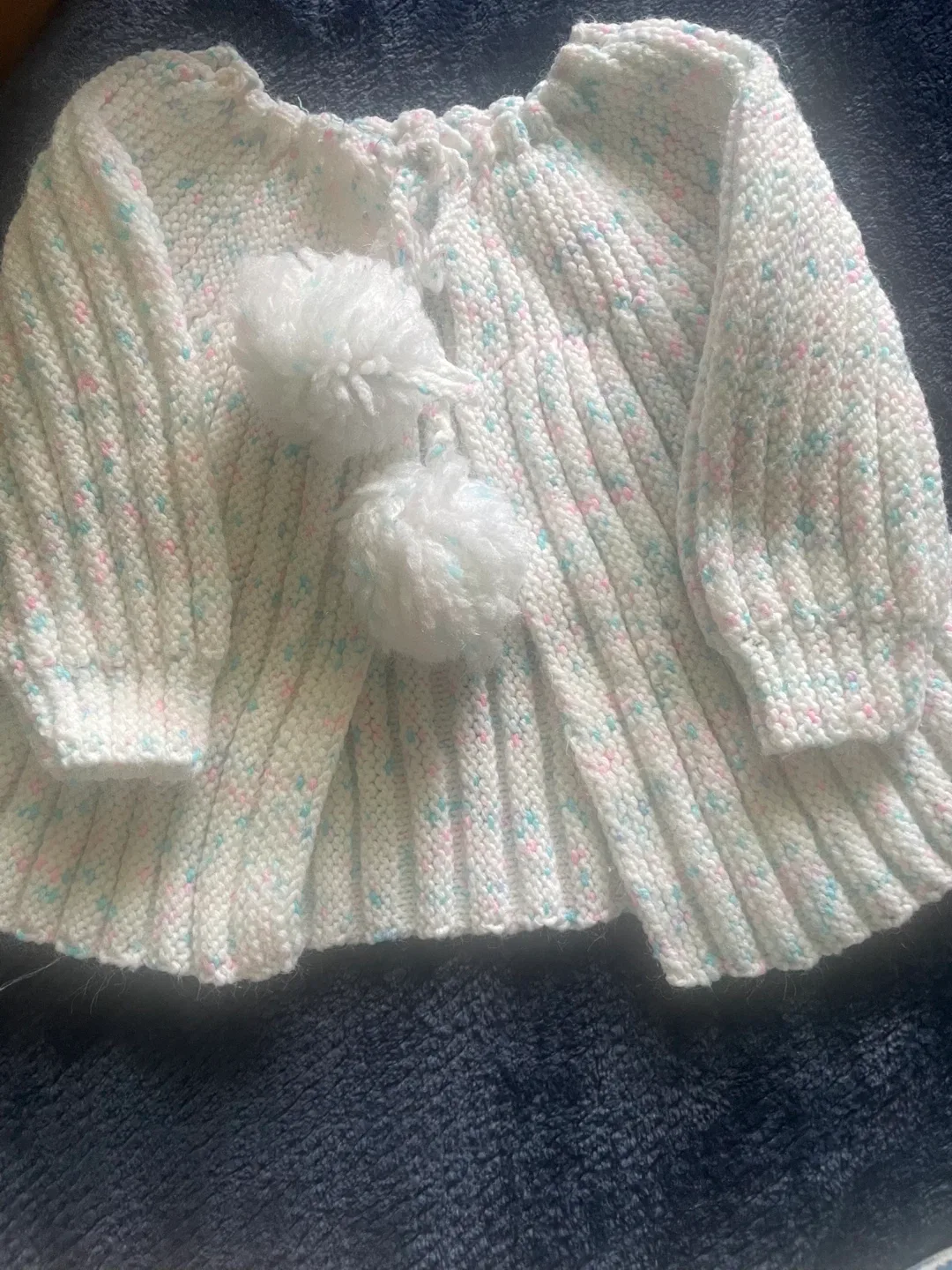 Hand-Knitted Baby Cardigan with Pom Poms thumbnail