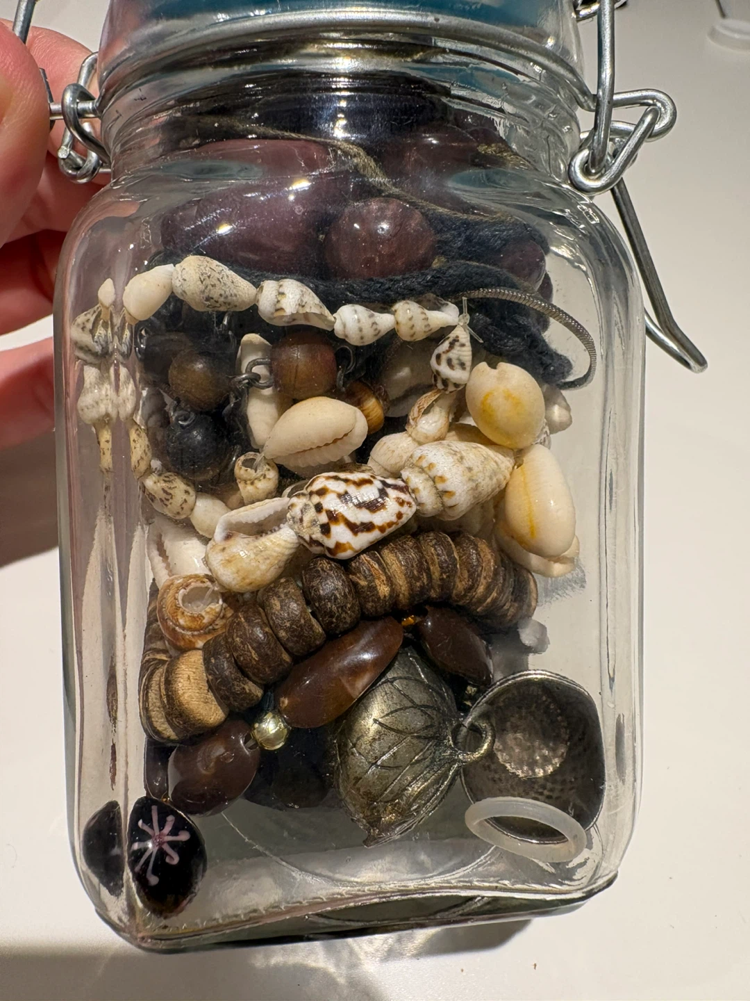 4 bracelets and a jar of mixed pendants and necklaces - photo 4