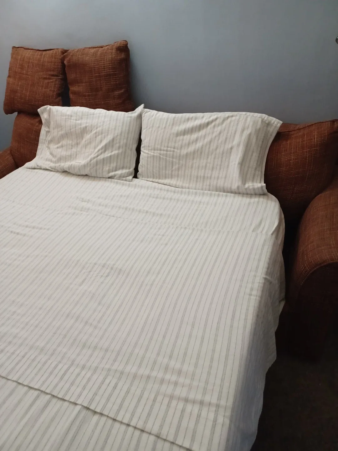 Comfortable Orange Sofa bed with Pillows image indicator(4)