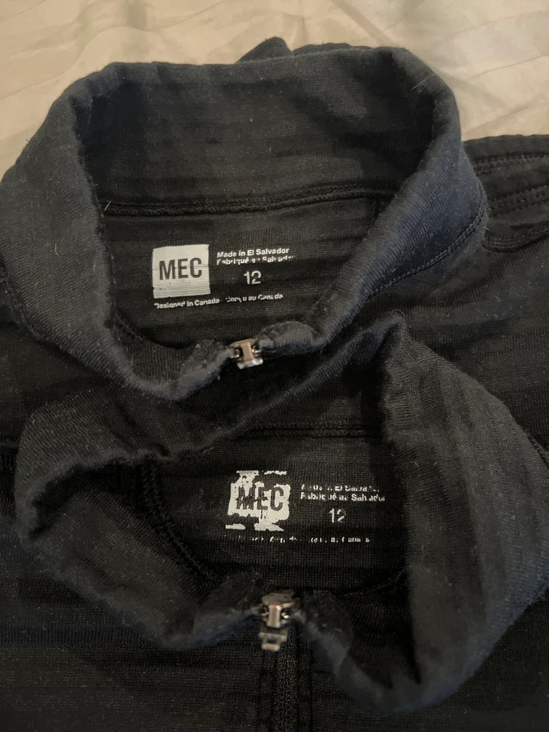 2 MEC Black 1/2 Zip base layer tops  - Size 12 youth image indicator(2)