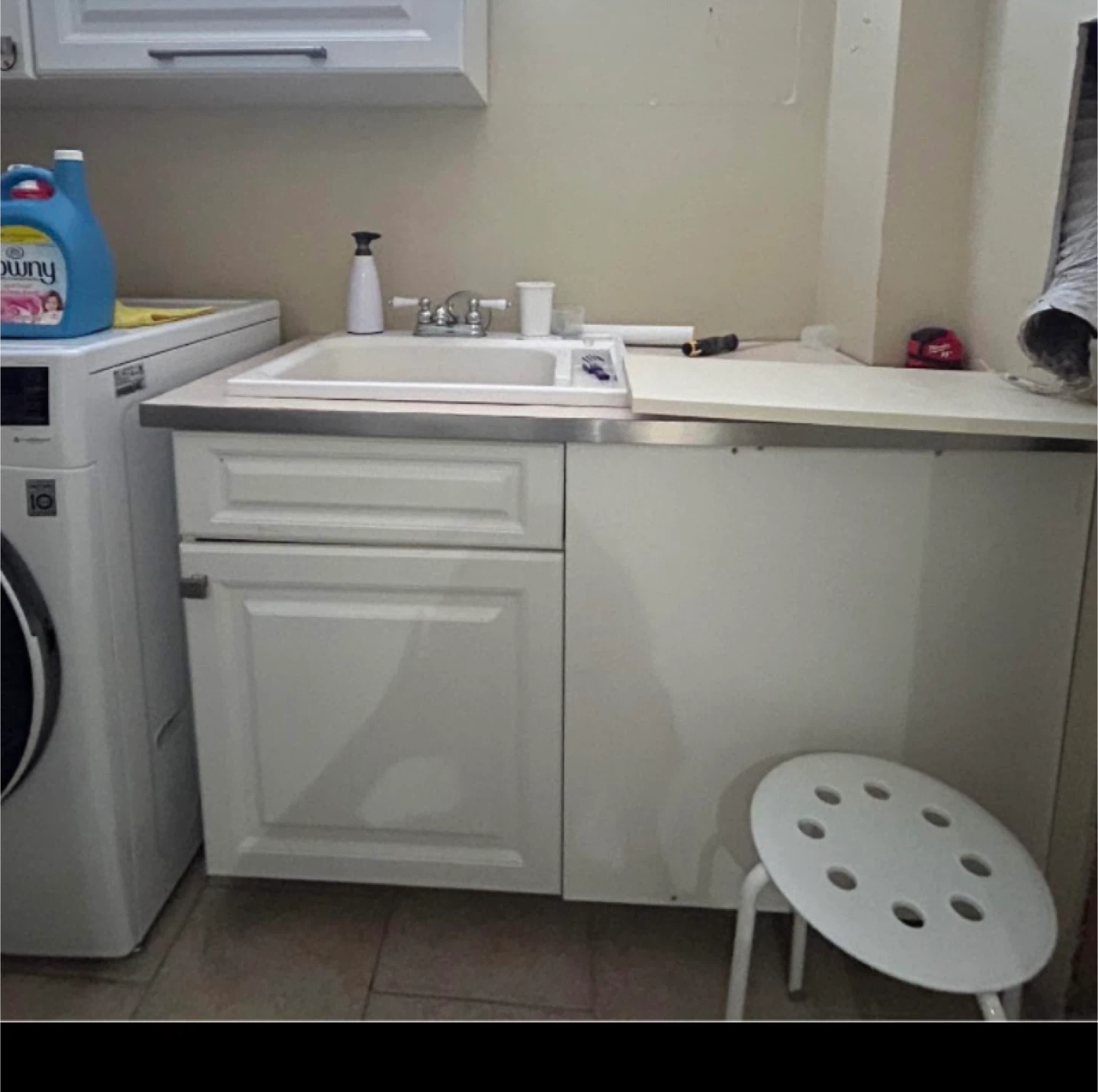 Laundry room sink with cabinet