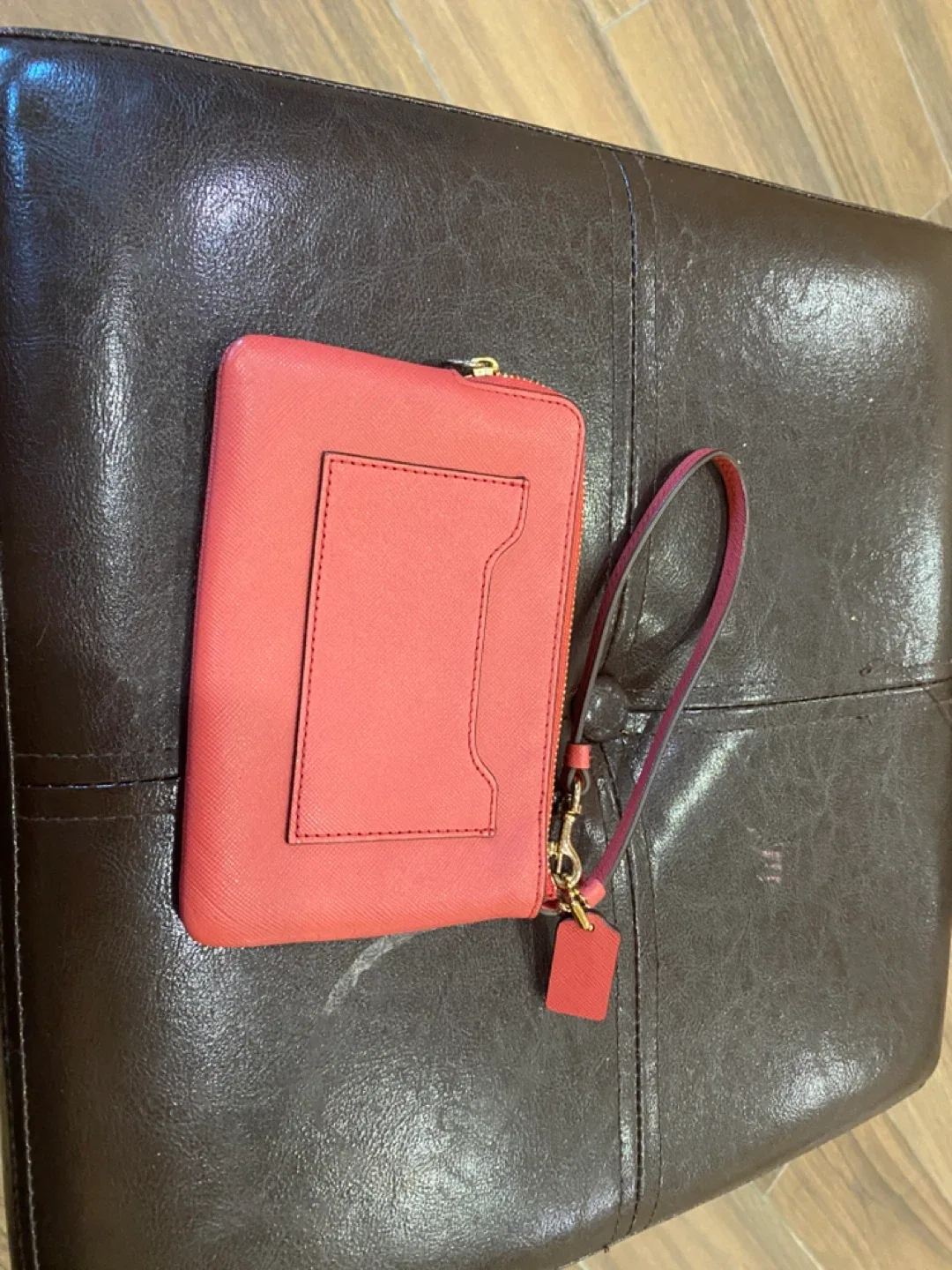 Coach Wristlet Coral Color image indicator(2)