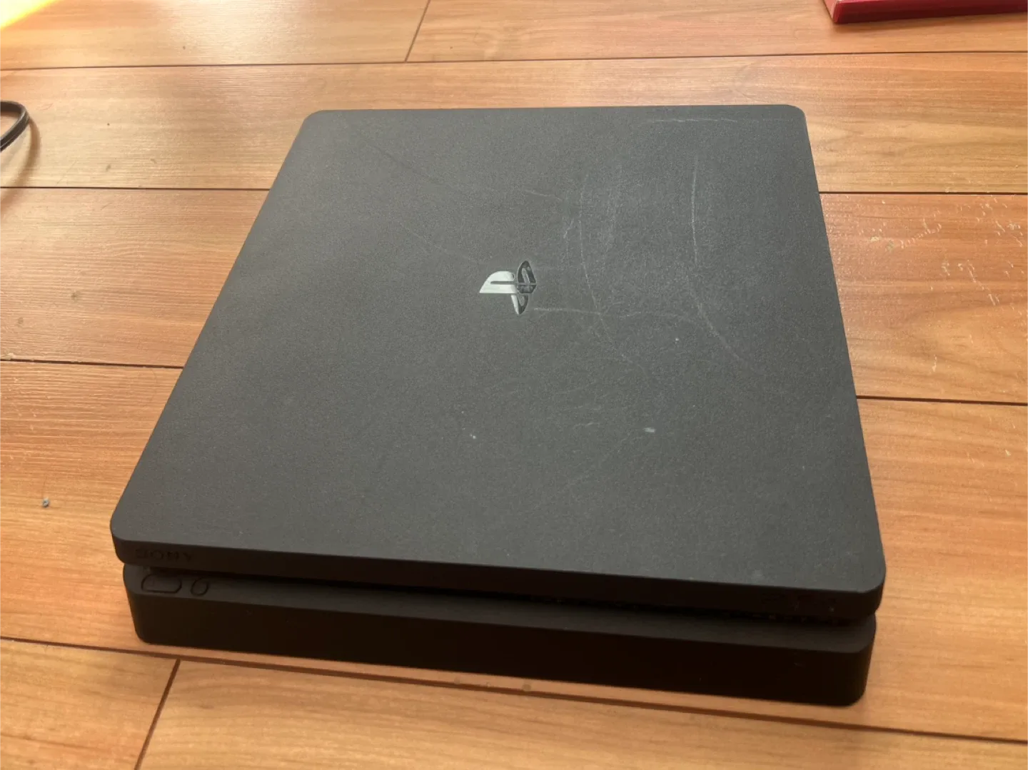 PlayStation 4 with 4 controllers and 7 games thumbnail