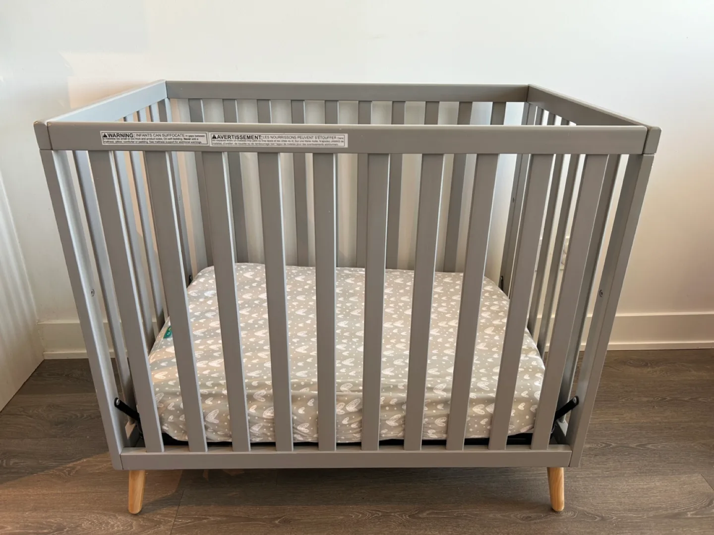 Delta Children Tucker Mini Crib with Mattress and Covers thumbnail