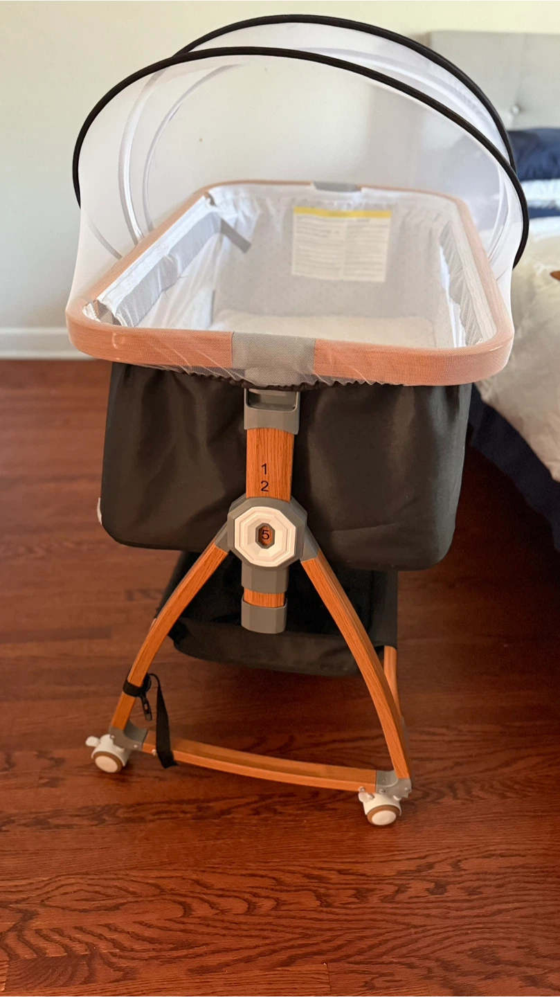 Mereryi baby beside bassinet sleeper